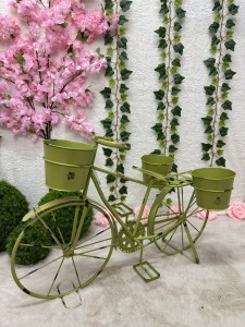 Rower metalowy zielony z miejscem na donice 53