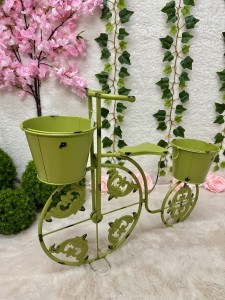 Rower metalowy zielony z miejscem na donice 50